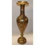 A large Indian brass baluster-shaped tapered floor vase with floral decoration,