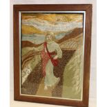 An old needlework tapestry wool-work picture depicting a religious figure within a landscape,