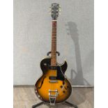 A 1993 Gibson ES135 hollow body electric guitar, two tone sunburst body, serial no. 92953378