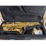 An unbranded alto saxophone, etched detail, fitted case