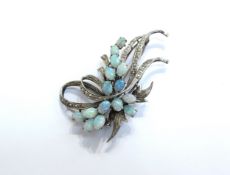 A white gold opal set brooch as a sprig, stamped 18k, 6cm x 3.3cm, 11.1g