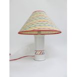 A 1980's iconic primary colour and white glazed pottery table lamp base and original cloth shade.