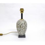 An Italian porcelain table lamp base, white ground with printed design in black and gold. Black