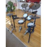 A Roland V-Drums five piece electronic drum kit, comprising TD-25 sound module, two PDX-100 pads,