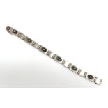 A Georg Jensen Lotus flower bracelet designed by Henry Pilstrup, stamped 56B 925, 18.5cm long, 28.