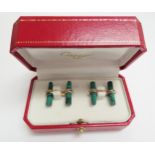 CARTIER, a pair of 'trinity' cufflinks in 18ct gold, each cufflink set with two malachite batons