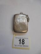 A silver vesta case.