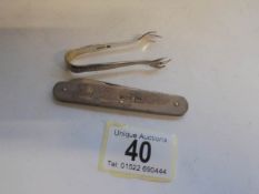 A silver penknife and a small pair of sugar nips.