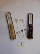 Ten vintage stick pins including horse shoes, grouse etc. (no marks but possibly some gold & silver)