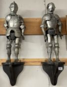 A pair of small suits of armour on wooden plinths - possibly German