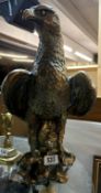 A 1930s Chalkware large figure of a golden eagle with a gilt brass finish. Height 46cm