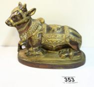 A heavy gilt brass nandi statue