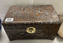 A Chinese wooden box with carved bird design