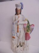 An early 20th century Staffordshire Scottish figure - Bird trainer.