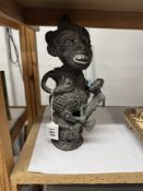 A heavy bronze African TIkar maternity figure representing motherhood & fertility