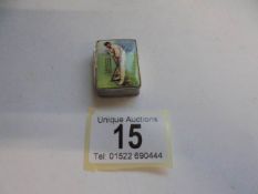 A silver (625) pill box featuring a cricket batsman on lid.