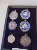 Six assorted silver fobs.