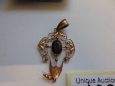 A Victorian yellow metal pendant set garnet.