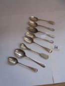 Eight assorted spoons including seven silver spoons, total weight 110 grams.