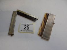 A silver cased hair comb and a silver plated example.