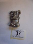 A novelty vesta case in the form of a clown.