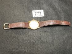 A 9ct gold Timor 21 Jewels watch with leather strap