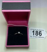 A white gold single stone diamond ring 1.07 grams, Size M