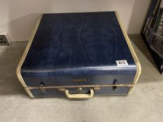 A vintage lined blue Samsonite hard shell luggage suitcase