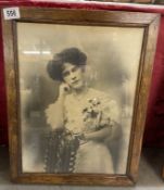 A framed & glazed black & white picture of a Victorian woman