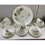 A collection of 19th century Minton hand painted cups & saucers, aesthetic movement featuring wild