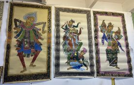 Three fabric paintings of Balinese dancers, signed M.D. Budi