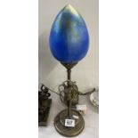 A vintage heron glass table lamp with blue iridescent shade & figural brass base