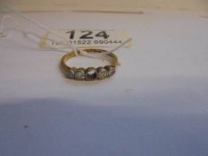 An 18ct gold and platinum ring, missing one stone. 2 grams.