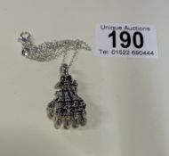 A silver necklace in the form of a hand 15.4 grams