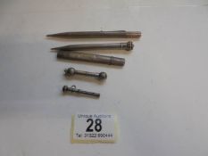 Five assorted silver pencils, 46 grams.