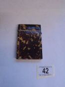 A 19th century tortoise shell card case.