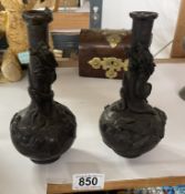 A pair of antique Japanese bronze dragon vases