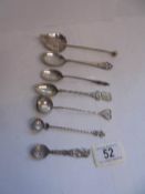 Seven assorted spoons (some possibly silver).