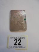 A small silver card case.