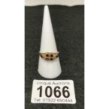 A 19th century almandine garnet ring chased gold work to settings & shoulders in 9ct rose gold