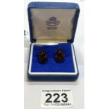 A pair of 19th century garnet ear studs cabochon cut & round cut garnets