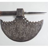An Indian Axe the crescent shaped head engraved with scenes of elephant and handlers and prisoners