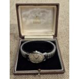 A Garrard gents 1960s wristwatch bearing presentation inscription, in original case.