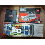 A Lego Ghostbusters Ecto-1, with instruction booklet & original box & with game of bricks light