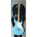 A Line 6 Variax electric guitar with soft bag, leads and foot pedal.