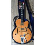 A Peerless Tonemaster Standard semi acoustic arch top electric guitar with hard case.