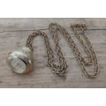 A ladies vintage gold plated pendant watch with gold plated chain.