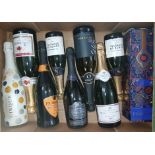 Nine bottles of assorted sparkling wine.