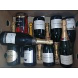 Nine bottles of assorted sparkling wine.
