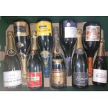 Nine bottles of assorted sparkling wine.